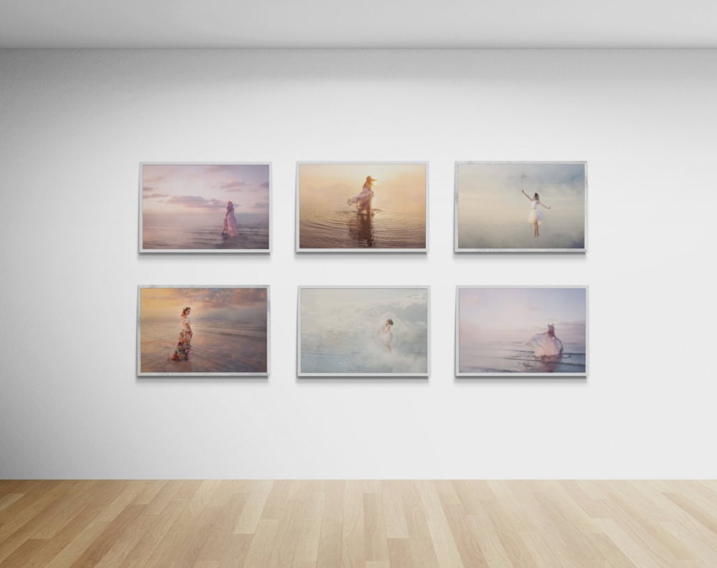 A selection of Louisa's fine art photography prints hang on a gallery wall